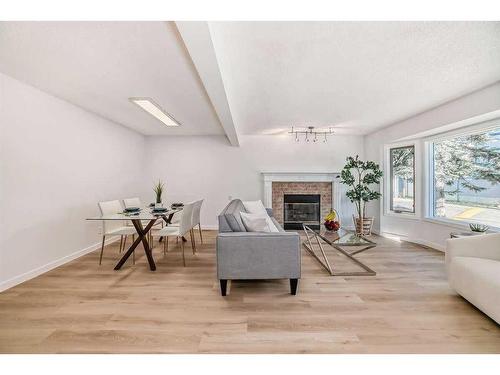 222 Cedarwood Park Sw, Calgary, AB - Indoor Photo Showing Living Room With Fireplace