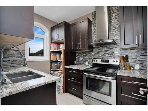 242-27240 Township Road 392, Rural Red Deer County, AB - Indoor Photo Showing Kitchen With Double Sink