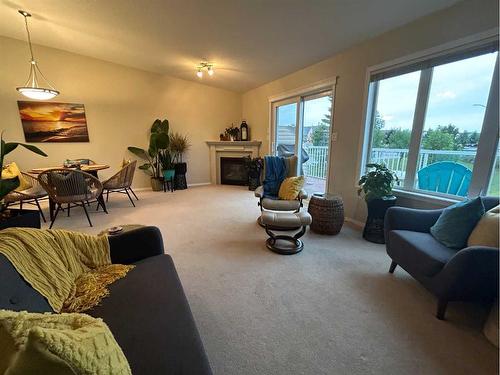 4527 71 Street Close, Camrose, AB - Indoor Photo Showing Living Room With Fireplace