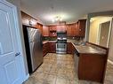 205-5204 52 Avenue, Tofield, AB  - Indoor Photo Showing Kitchen With Double Sink 