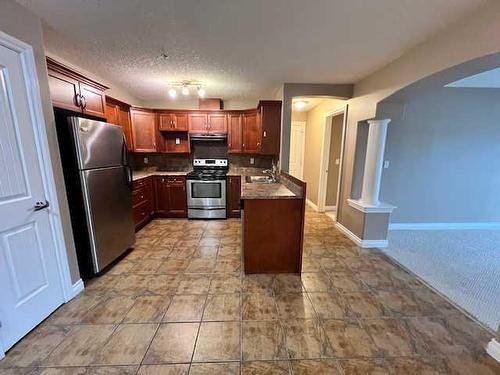 205-5204 52 Avenue, Tofield, AB - Indoor Photo Showing Kitchen With Double Sink