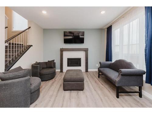 137 Hampton Crescent, Sylvan Lake, AB - Indoor Photo Showing Living Room With Fireplace