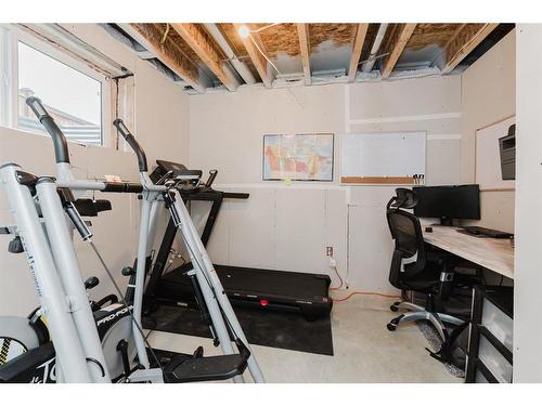 137 Hampton Crescent, Sylvan Lake, AB - Indoor Photo Showing Gym Room