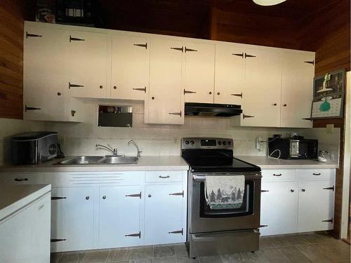 1303 Baptiste Drive, West Baptiste, AB - Indoor Photo Showing Kitchen With Double Sink