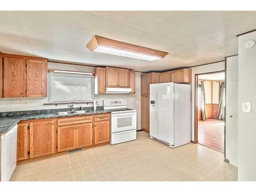 6743 59 Avenue, Red Deer, AB - Indoor Photo Showing Kitchen With Double Sink