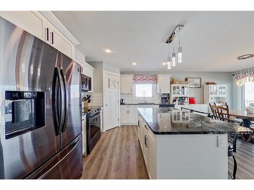 13 Valarosa Cove, Didsbury, AB - Indoor Photo Showing Kitchen With Stainless Steel Kitchen With Upgraded Kitchen