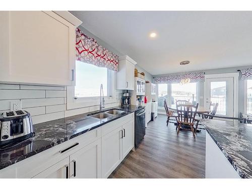 13 Valarosa Cove, Didsbury, AB - Indoor Photo Showing Kitchen With Double Sink