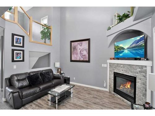 33 Duval Crescent, Red Deer, AB - Indoor Photo Showing Living Room With Fireplace