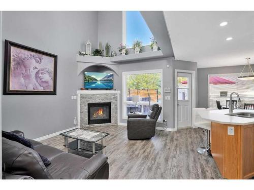 33 Duval Crescent, Red Deer, AB - Indoor Photo Showing Living Room With Fireplace