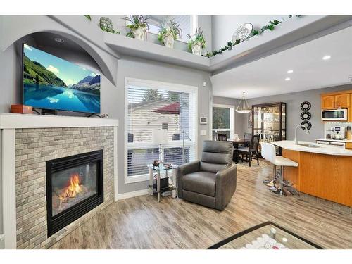 33 Duval Crescent, Red Deer, AB - Indoor Photo Showing Living Room With Fireplace