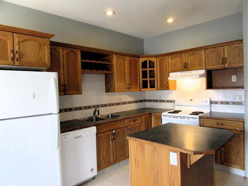 7 Adams Close, Red Deer, AB - Indoor Photo Showing Kitchen With Double Sink