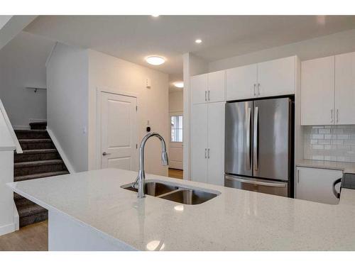 2095 Fowler Road Sw, Airdrie, AB - Indoor Photo Showing Kitchen With Double Sink With Upgraded Kitchen