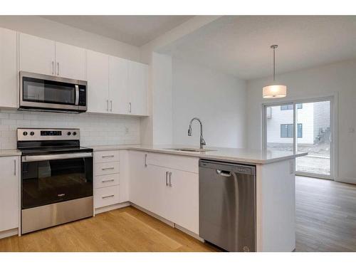 2095 Fowler Road Sw, Airdrie, AB - Indoor Photo Showing Kitchen With Upgraded Kitchen