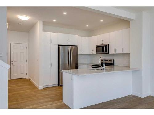 2095 Fowler Road Sw, Airdrie, AB - Indoor Photo Showing Kitchen With Double Sink