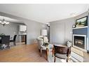 212-5326 47 Avenue, Red Deer, AB  - Indoor Photo Showing Living Room With Fireplace 