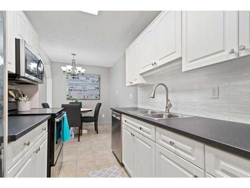 212-5326 47 Avenue, Red Deer, AB - Indoor Photo Showing Kitchen With Double Sink