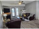 #116-5040 53 Street, Sylvan Lake, AB  - Indoor Photo Showing Living Room With Fireplace 