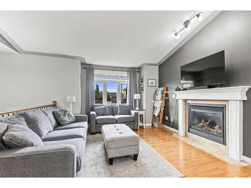 28 Van Dorp Street, Red Deer, AB - Indoor Photo Showing Living Room With Fireplace