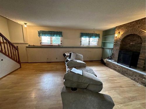 81 Metcalf Avenue, Red Deer, AB - Indoor Photo Showing Other Room With Fireplace