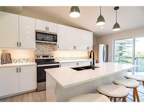 226-36078 Range Road 245 A, Rural Red Deer County, AB - Indoor Photo Showing Kitchen With Stainless Steel Kitchen With Double Sink With Upgraded Kitchen