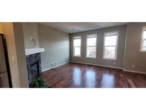 1073 New Brighton Grove Se, Calgary, AB - Indoor Photo Showing Other Room With Fireplace