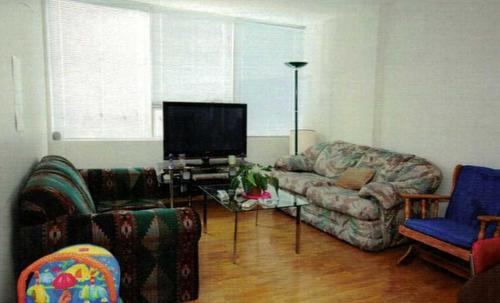 302-4820 47 Avenue, Red Deer, AB - Indoor Photo Showing Living Room