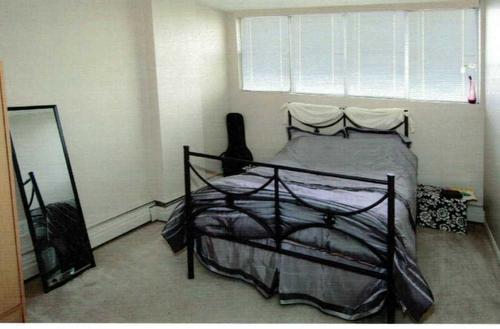 302-4820 47 Avenue, Red Deer, AB - Indoor Photo Showing Bedroom