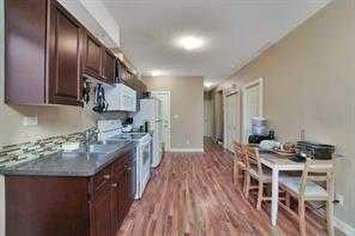 5800 56 Avenue, Red Deer, AB - Indoor Photo Showing Kitchen With Double Sink