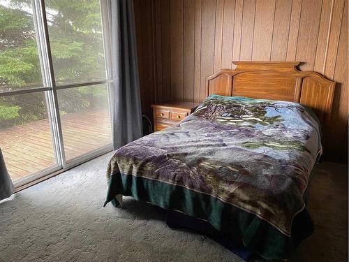 1301 Baptiste Drive, West Baptiste, AB - Indoor Photo Showing Bedroom