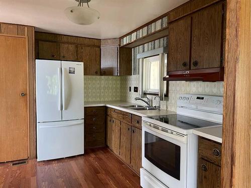 1301 Baptiste Drive, West Baptiste, AB - Indoor Photo Showing Kitchen With Double Sink