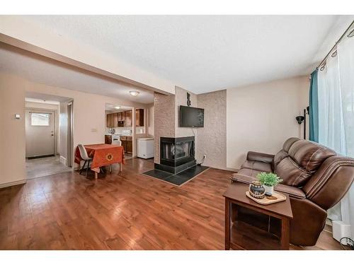 264 Cornett Drive, Red Deer, AB - Indoor Photo Showing Living Room With Fireplace