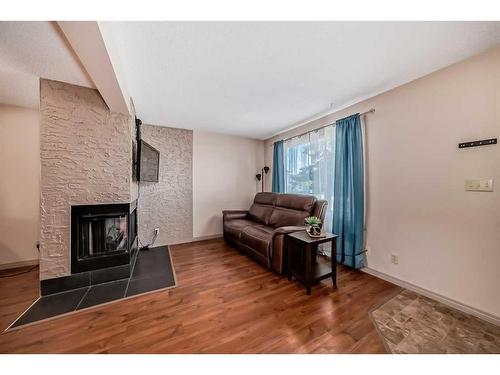 264 Cornett Drive, Red Deer, AB - Indoor Photo Showing Living Room With Fireplace