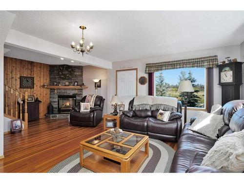 32570 Range Road 51, Rural Mountain View County, AB - Indoor Photo Showing Living Room With Fireplace