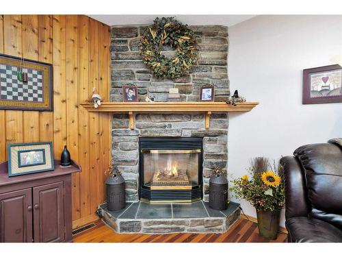 32570 Range Road 51, Rural Mountain View County, AB - Indoor Photo Showing Living Room With Fireplace