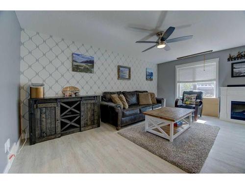 4825 Aspen Lakes Boulevard, Blackfalds, AB - Indoor Photo Showing Living Room With Fireplace