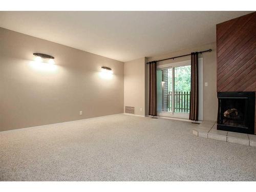 7-80 Piper Drive, Red Deer, AB - Indoor With Fireplace