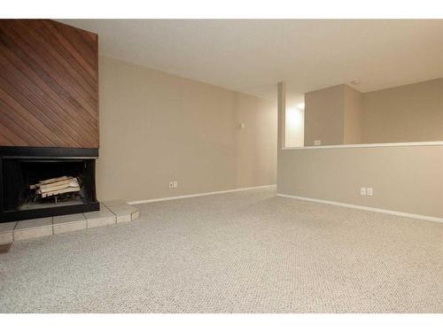 7-80 Piper Drive, Red Deer, AB - Indoor With Fireplace