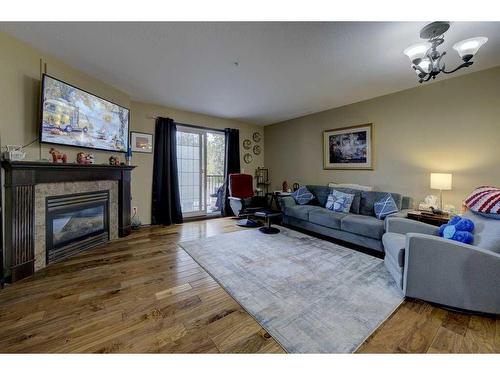 101-3505 51 Avenue, Red Deer, AB - Indoor Photo Showing Living Room With Fireplace