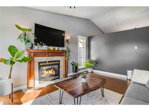 25 Regent Close, Lacombe, AB - Indoor Photo Showing Living Room With Fireplace