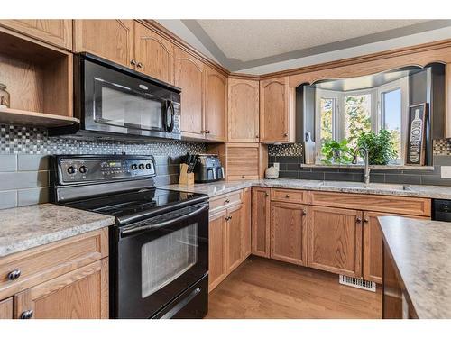 25 Regent Close, Lacombe, AB - Indoor Photo Showing Kitchen With Double Sink