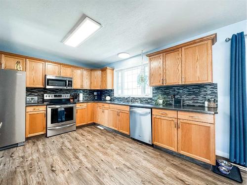 5916 42 Avenue, Stettler, AB - Indoor Photo Showing Kitchen With Stainless Steel Kitchen With Double Sink