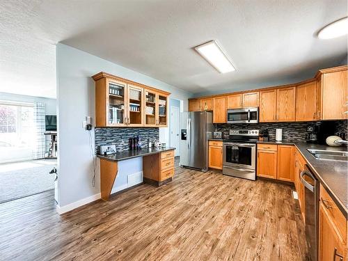 5916 42 Avenue, Stettler, AB - Indoor Photo Showing Kitchen With Stainless Steel Kitchen With Double Sink