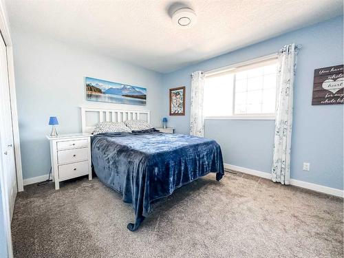 5916 42 Avenue, Stettler, AB - Indoor Photo Showing Bedroom