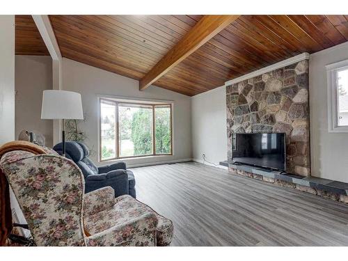 6230 61 Avenue, Red Deer, AB - Indoor Photo Showing Living Room With Fireplace