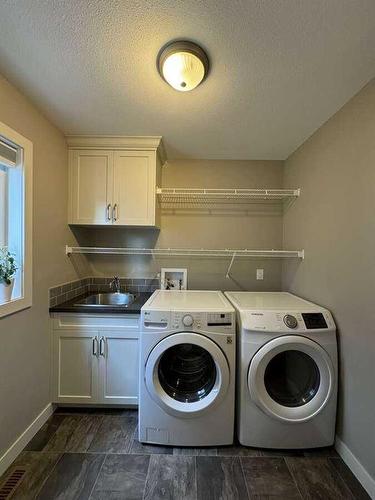 413 10B Street, Nobleford, AB - Indoor Photo Showing Laundry Room