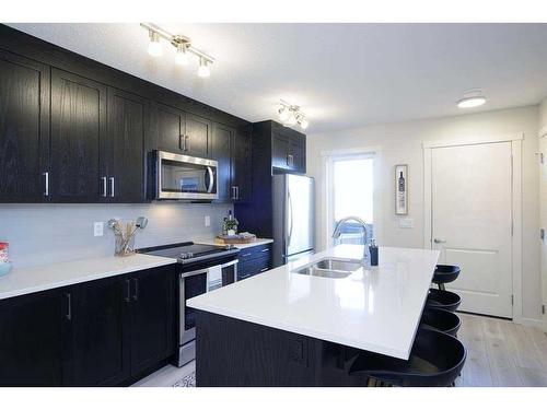 703-135 Mahogany Parade Se, Calgary, AB - Indoor Photo Showing Kitchen With Double Sink With Upgraded Kitchen