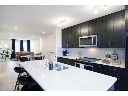 703-135 Mahogany Parade Se, Calgary, AB - Indoor Photo Showing Kitchen With Double Sink With Upgraded Kitchen