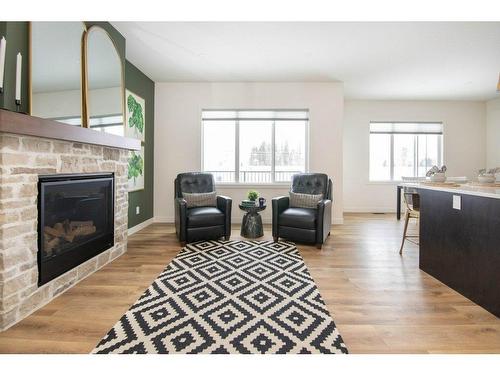 140 Emerald Drive, Red Deer, AB - Indoor Photo Showing Living Room With Fireplace