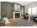 140 Emerald Drive, Red Deer, AB  - Indoor Photo Showing Living Room With Fireplace 