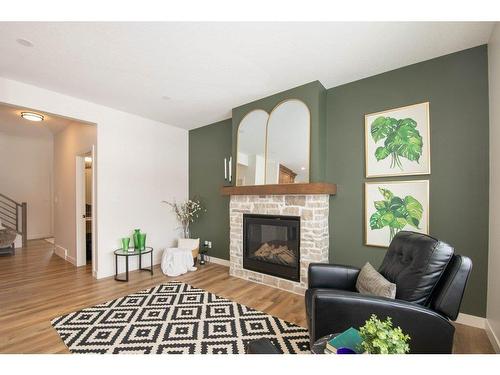 140 Emerald Drive, Red Deer, AB - Indoor Photo Showing Living Room With Fireplace